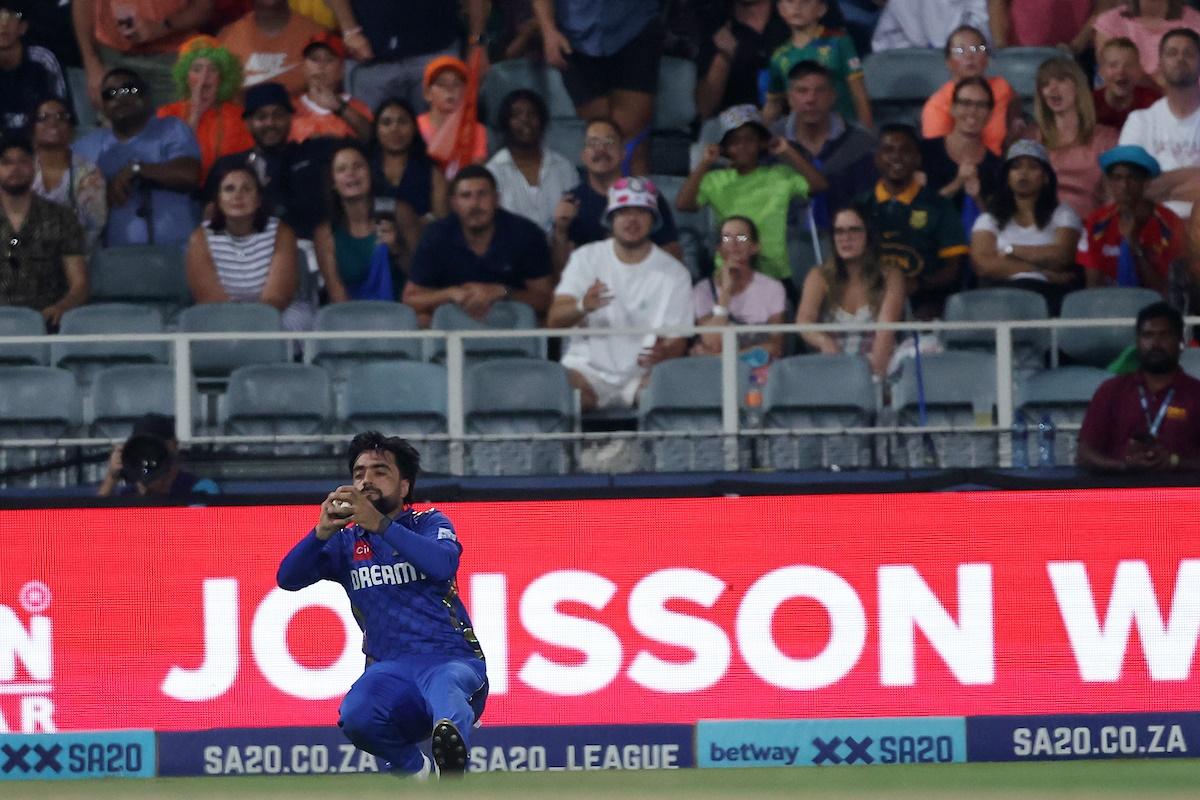 Rashid Khan takes the catch to dismiss Marco Jansen.