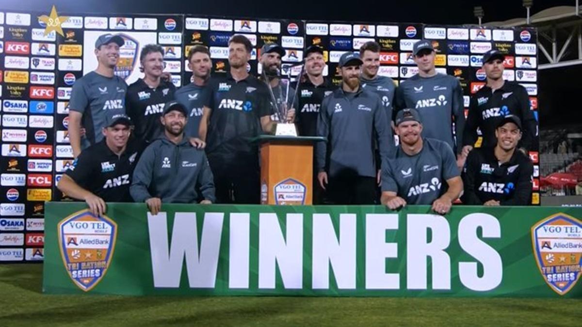 New Zealand's players celebrate with the trophy after beating Pakistan in the final of the tri-series in Karachi on Friday.