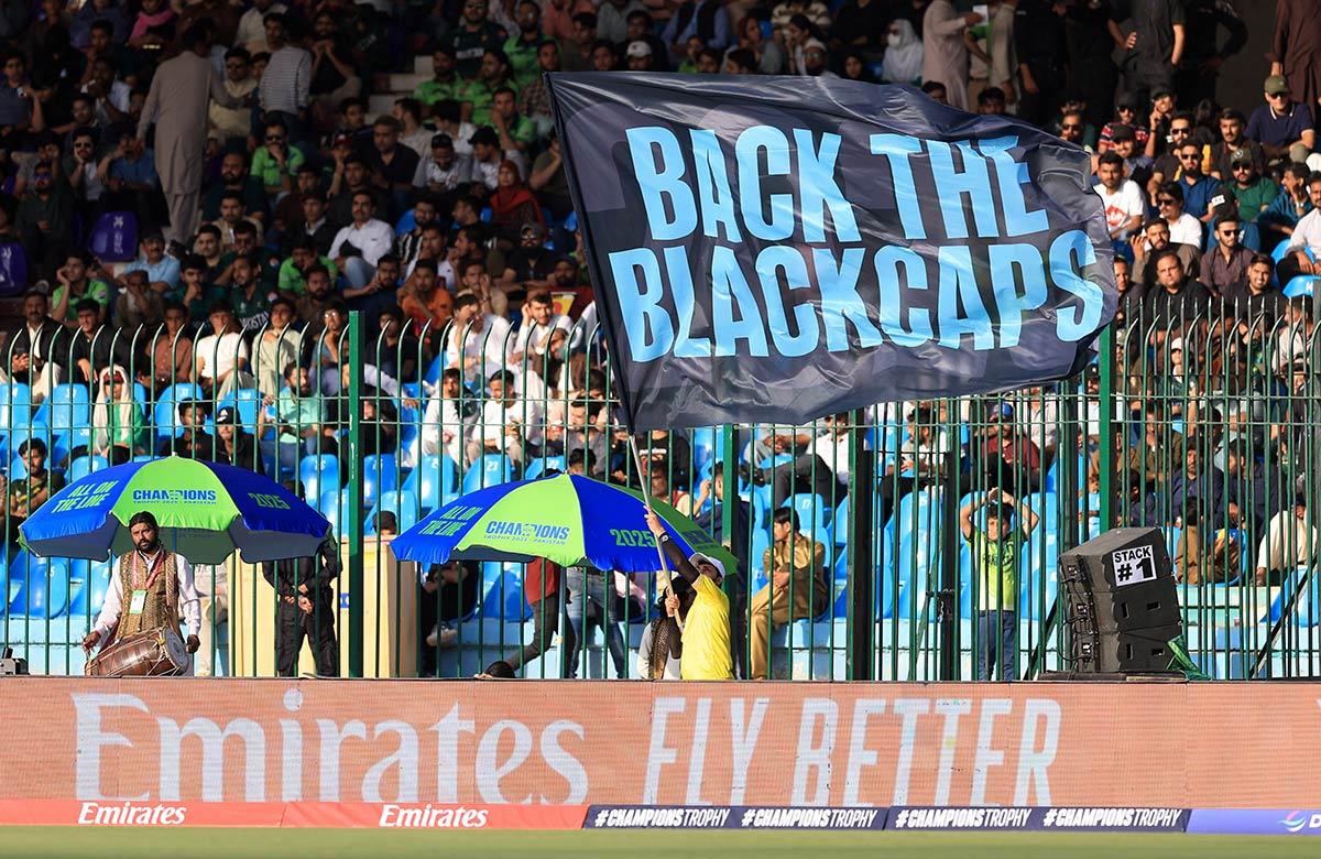 Fans with banner supporting New Zealand