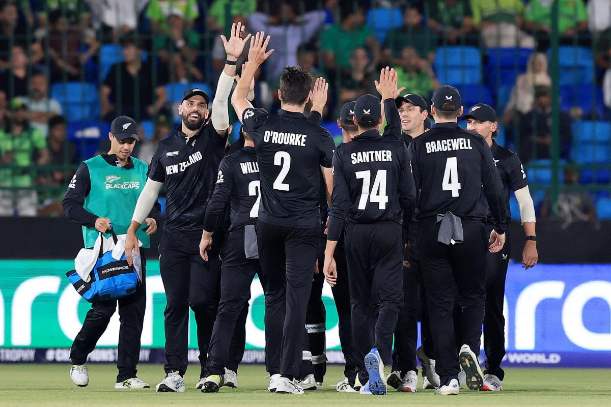 New Zealand's Will O'Rourke celebrates with teammates after taking the wicket of Pakistan's Saud Shakeel, caught out by Matt Henry