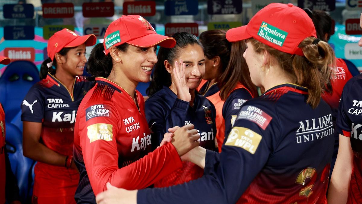 Royal Challengers Bengaluru captain Smriti Mandhana celebrates with teammates after victory over Delhi Capitals in the Women's Premier League 2025 match at the BCA stadium, Vadodara, February 17, 2025