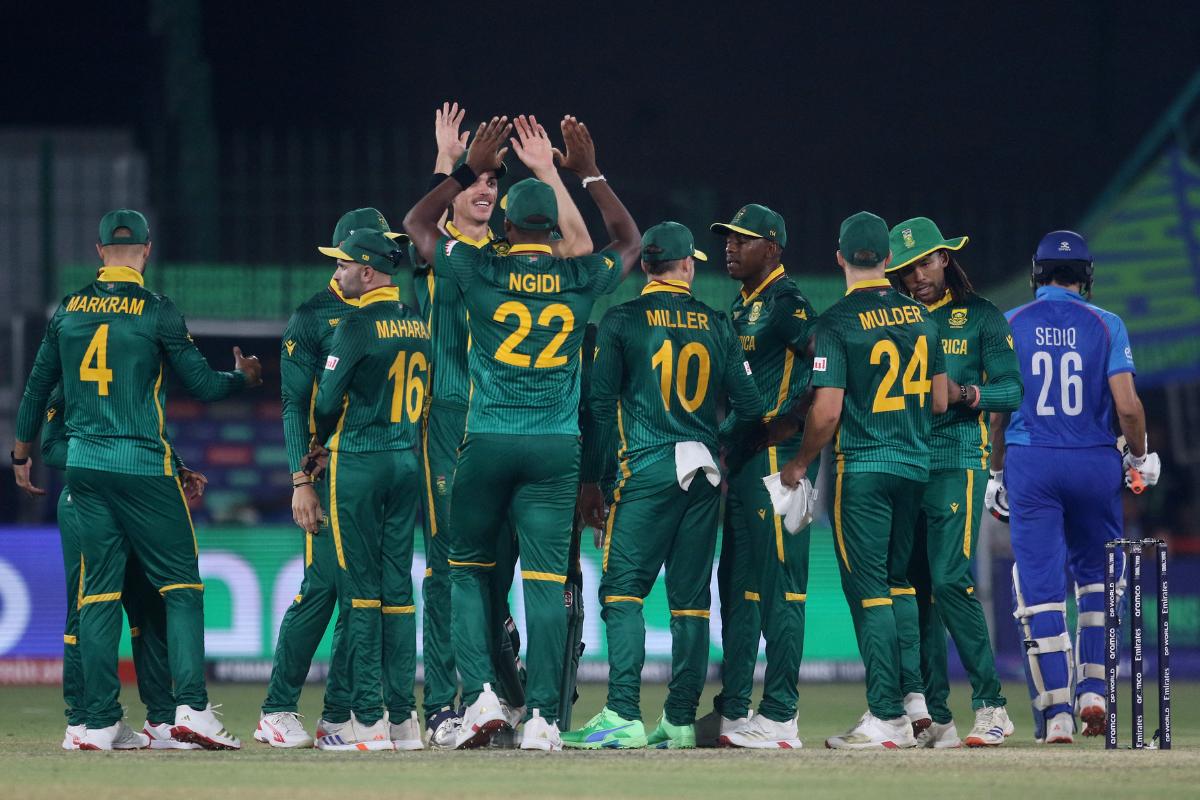 South Africa's Kagiso Rabada celebrates with teammates after running out Afghanistan's Sediqullah Atal