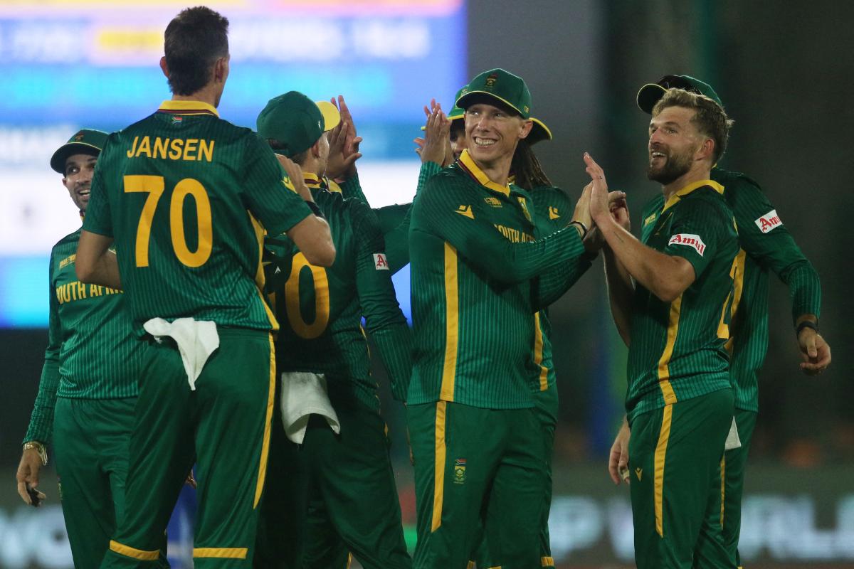 South Africa's Wiaan Mulder celebrates with teammates after taking the wicket of Afghanistan's Hashmatullah Shahidi