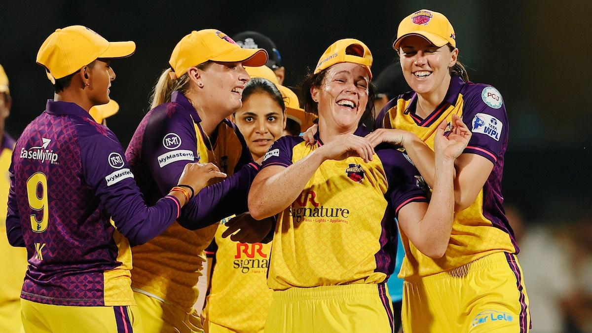 Grace Harris celebrates her hat-trick with her UP Warriorz teammates during the Women's Premier League 2025 match against Delhi Capitals at the M.Chinnaswamy Stadium, Bengaluru, on Saturday.