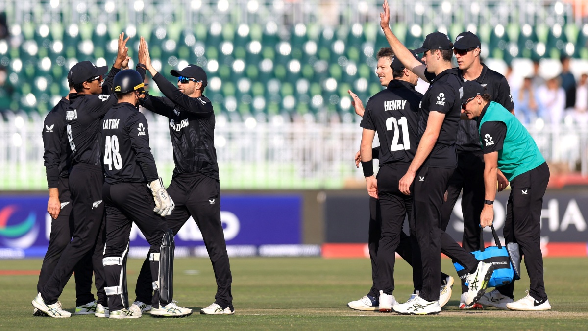 New Zealand's Rachin Ravindra celebrates after taking the catch to dismiss Bangladesh's Mushfiqur Rahim, off the bowling of Michael Bracewell