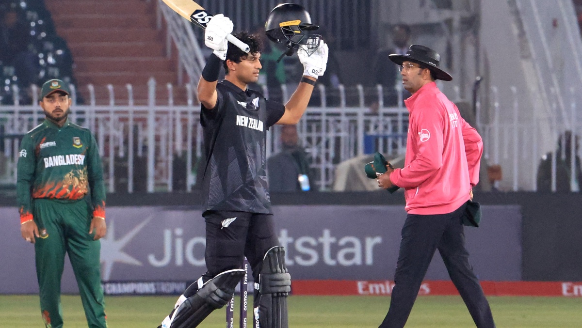 New Zealand's Rachin Ravindra celebrates reaching his century 