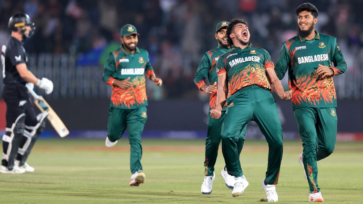 Bangladesh's Taskin Ahmed celebrates with teammates after taking the wicket of New Zealand's Will Young