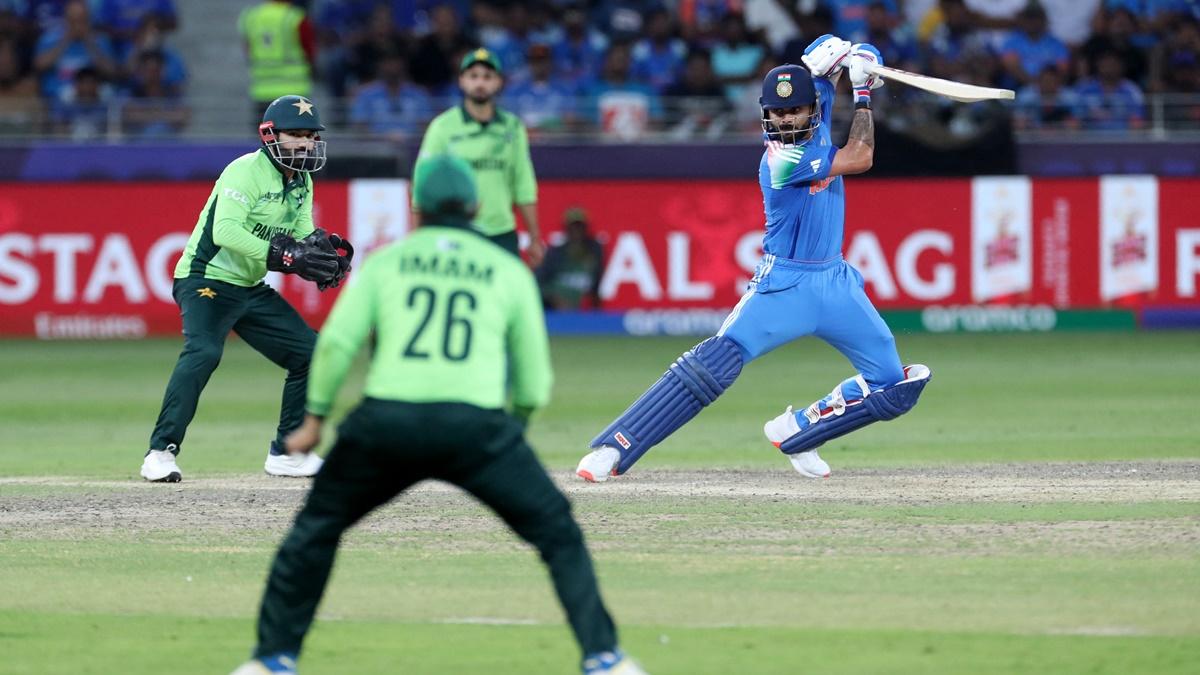 Pakistan fielders watch in awe as Virat Kohli sends the ball to the boundary during the Champions Trophy Group A match at the Dubai International Stadium, UAE, on February 23, 2025.