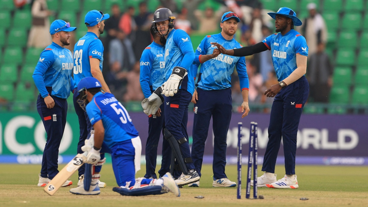 England's Adil Rashid celebrates with teammates after taking the wicket of Afghanistan's Hashmatullah Shahidi 