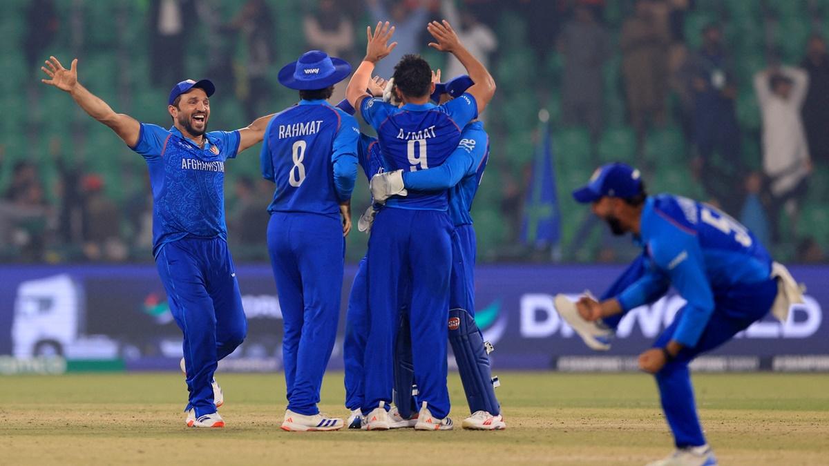 Afghanistan's players break into celebration after victory over England in the Champions Trophy Group B match at Gaddafi Stadium, Lahore, on Wednesday.