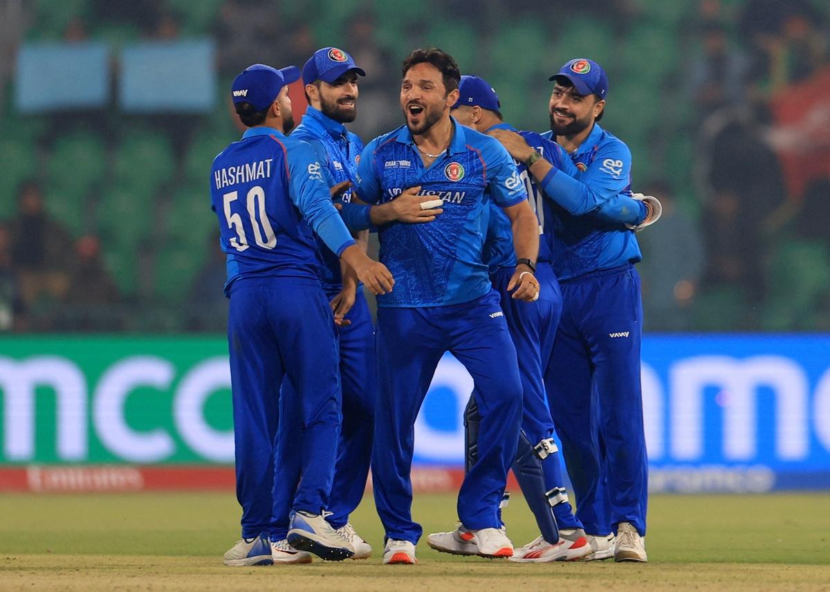 Gulbadin Naib celebrates with his Afghanistan teammates after dismissing England's Liam Livingstone