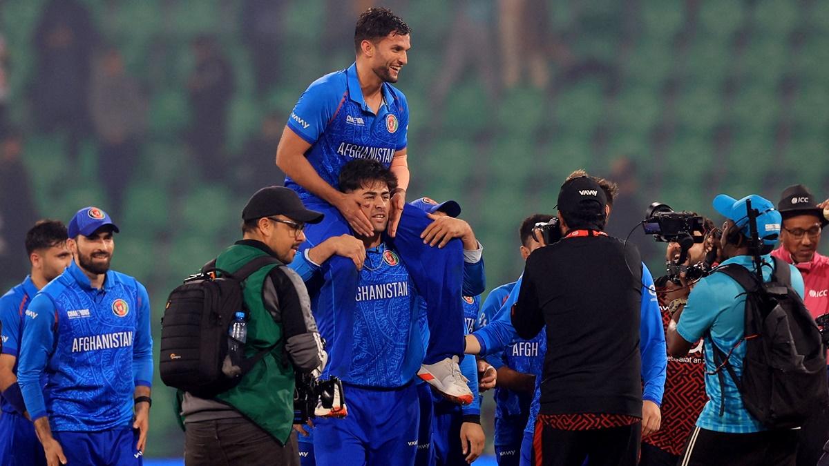 Afghanistan pacer Azmatullah Omarzai, who destroyed England with figures of five wickets for 58 runs, is chaired by teammates after the match.