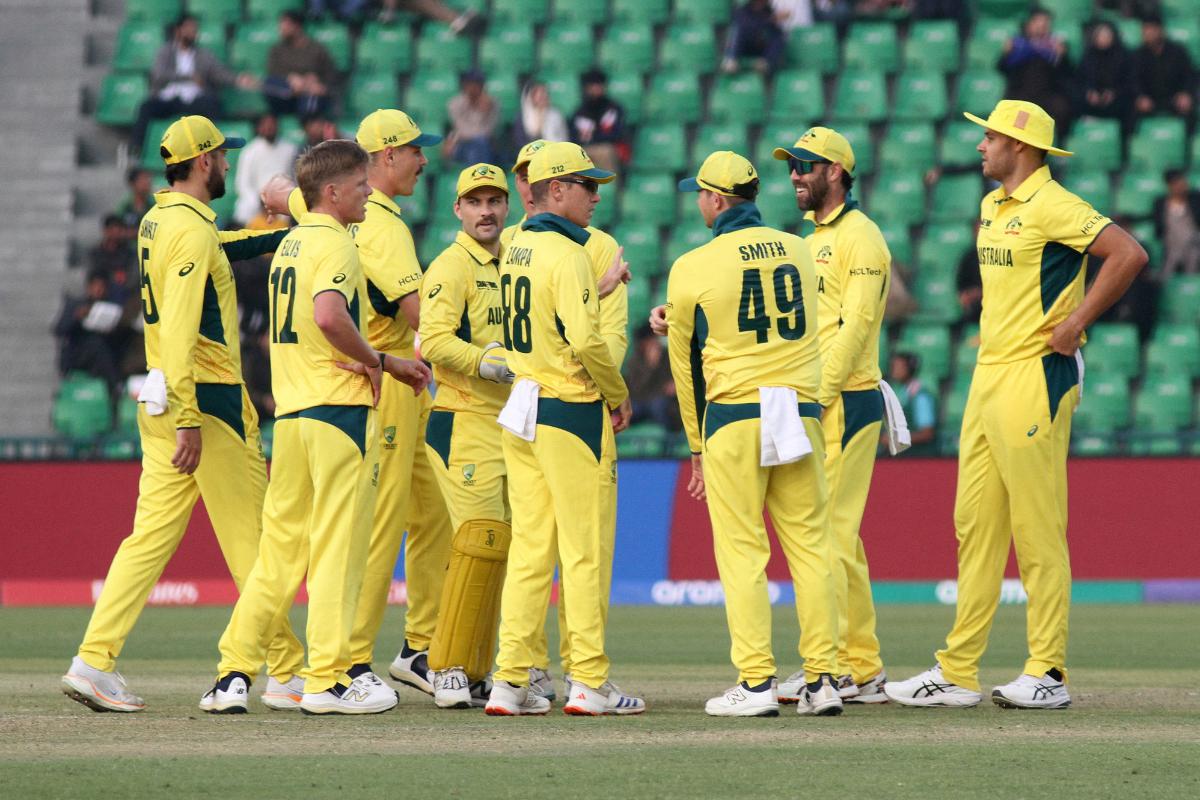 Australia's Nathan Ellis celebrates with teammates after taking the wicket of Afghanistan's Gulbadin Naib 