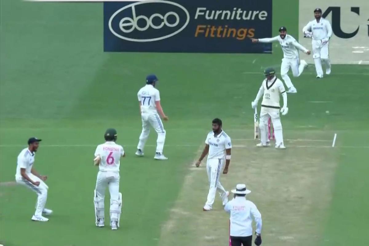 Indian players celebrate the wicket of Usman Khawaja at the stroke of stumps on Day 1 