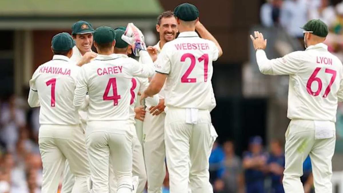 Australia pacer Mitchell Starc celebrates with teammates after dismissing India opener K L Rahul.