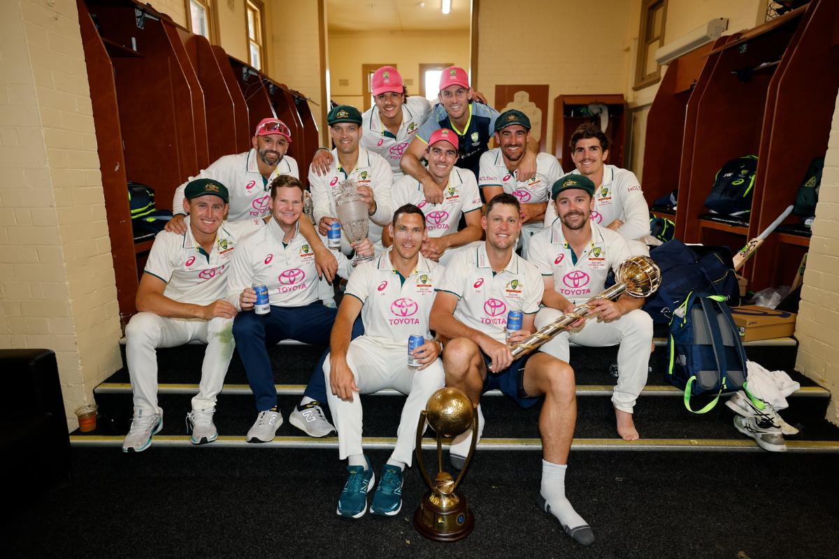 The Australian players celebrate in the dressing room