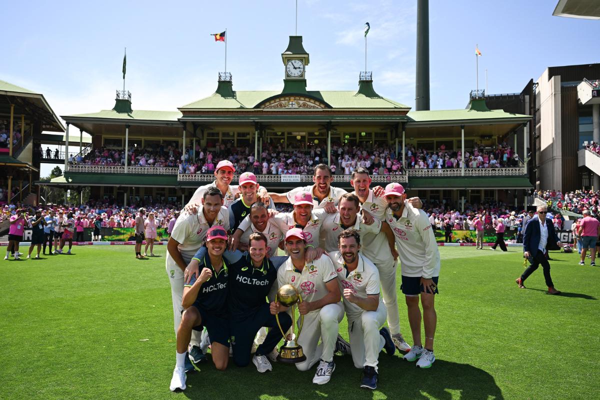 Australia players celebrate with the Border-Gavaskar Trophy at the SCG on Sunday