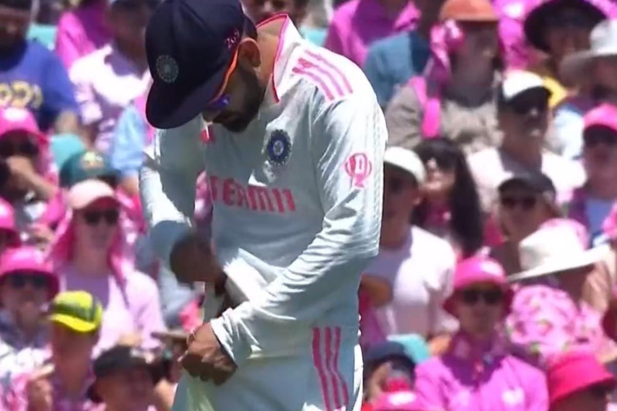 Virat Kohli looks down his trousers as he imitates Cameron Bancroft's infamous sandpaper gate incident