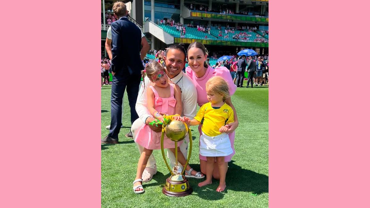 Usman Khawaja with his wife Rachel and daughters Aisha and Ayla as they pose with the Border-Gavaskar Trophy