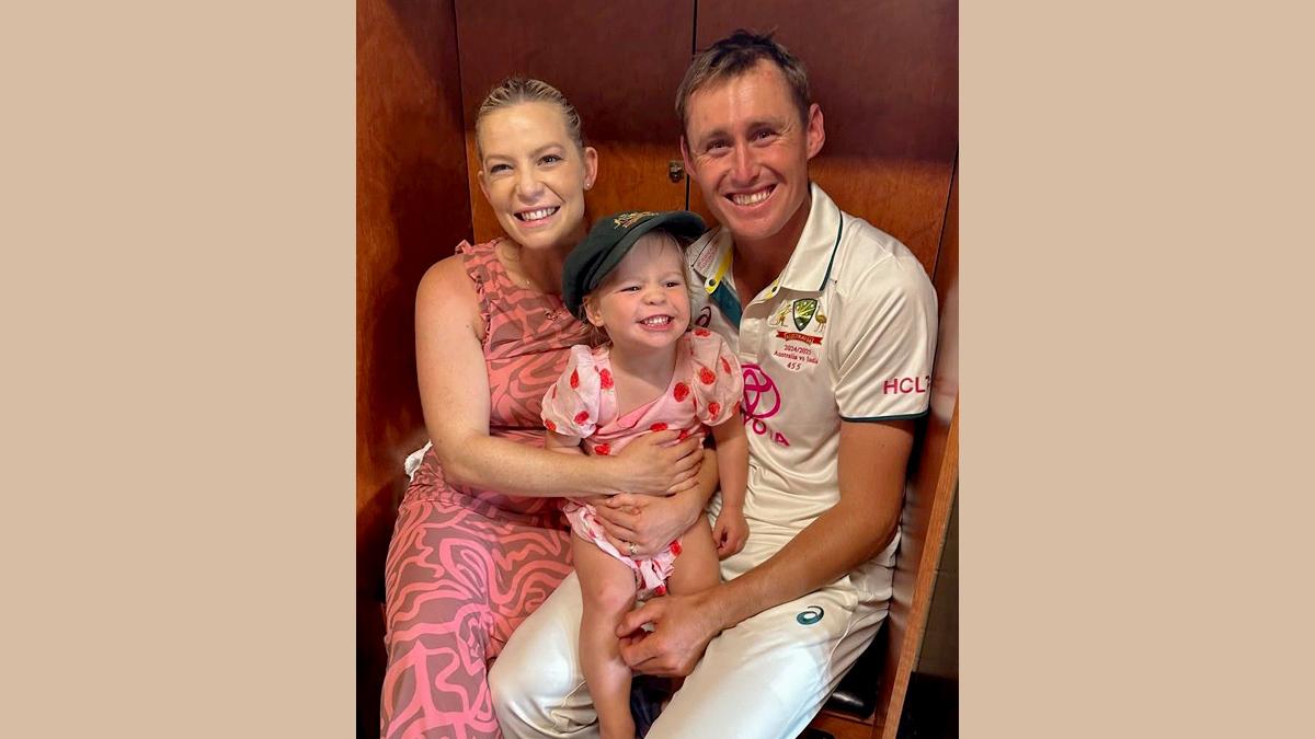 Marnus Labuschagne, wife Rebekah and daughter Hallie celebrate in the dressing room at the SCG on Sunday