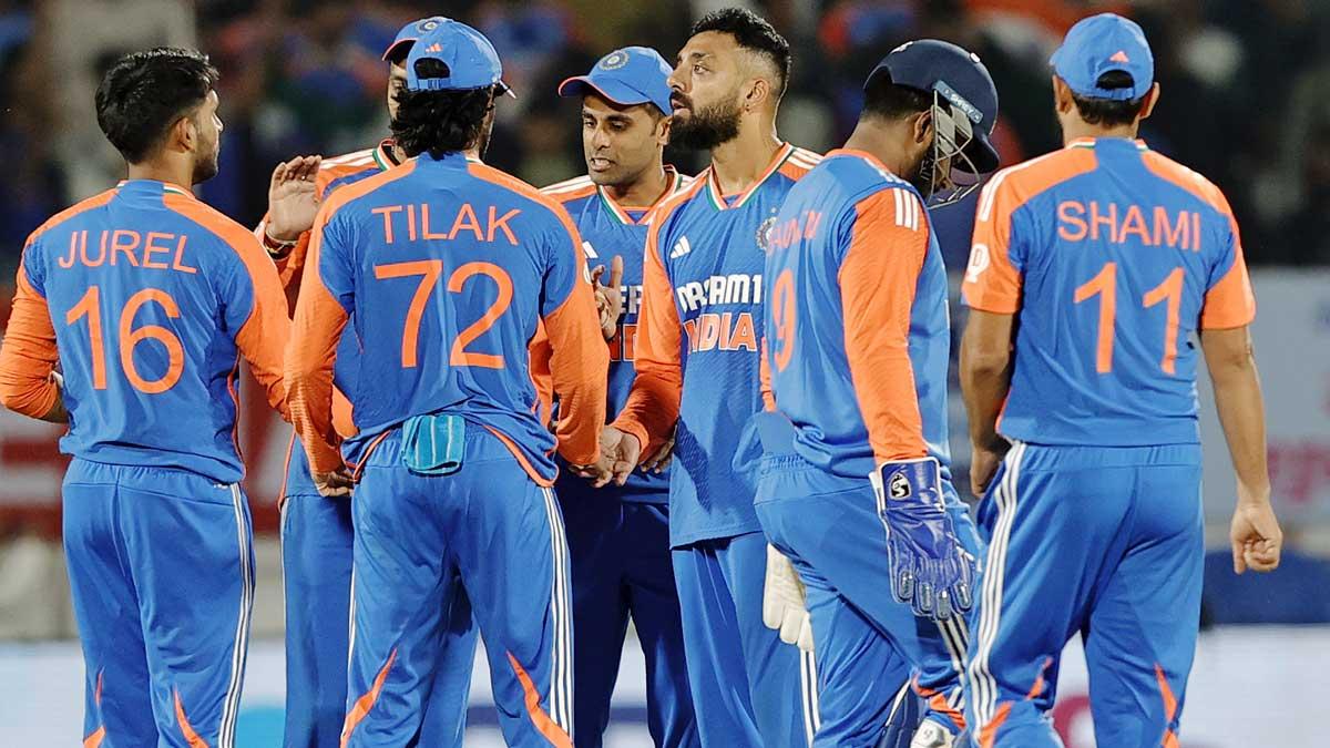 Varun Chakravarthy celebrates with team-mates after taking the wicket of Jamie Smith.