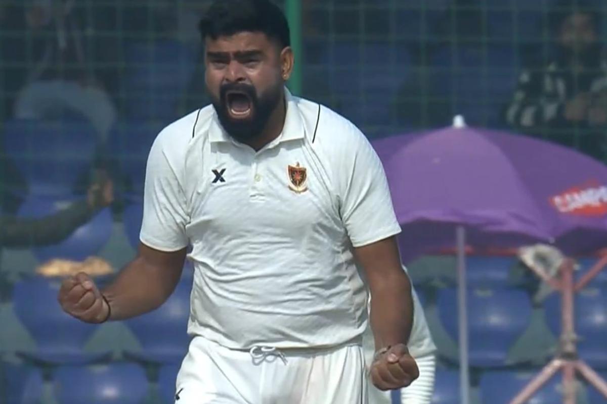 Railways seamer Himanshu Sangwan celebrates after dismissing Delhi's Virat Kohli with a peach, on Day 2 of their Ranji Trophy match in New Delhi on Friday