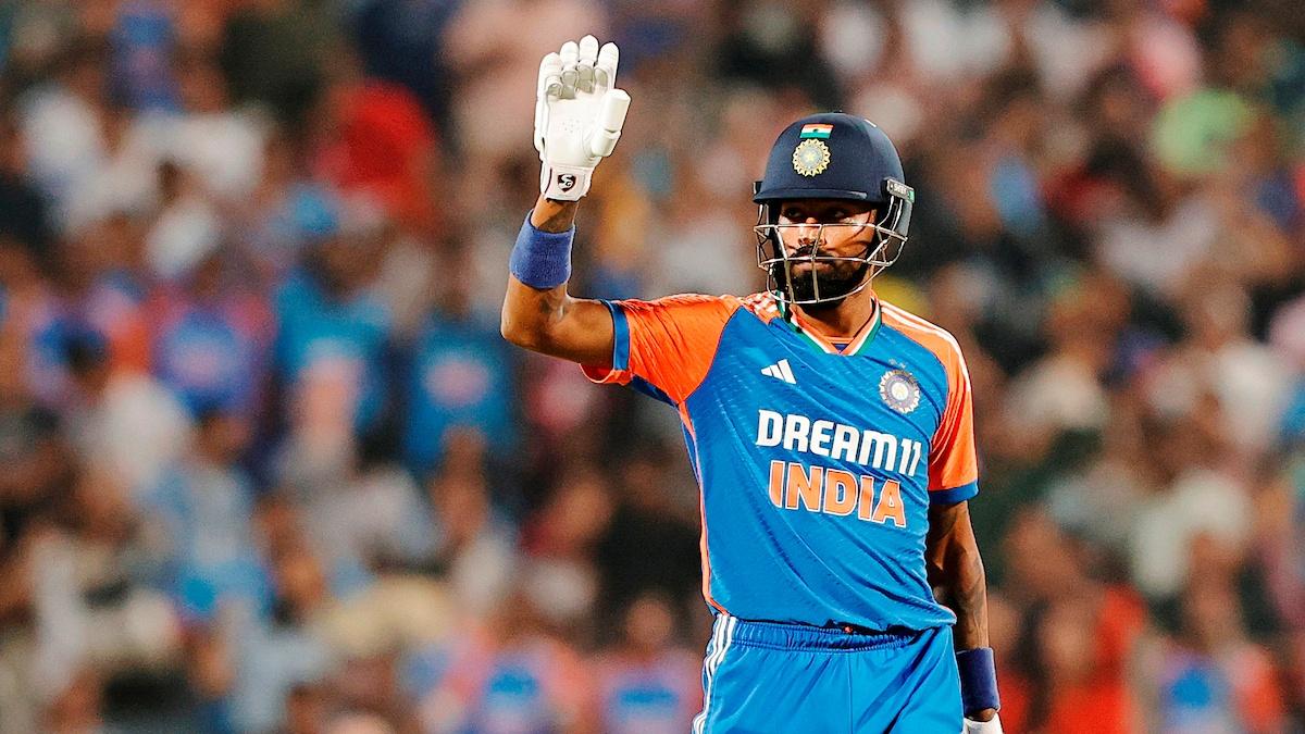 Hardik Pandya waves to the dressing room as he walks back after scoring 53 off just 31 balls.