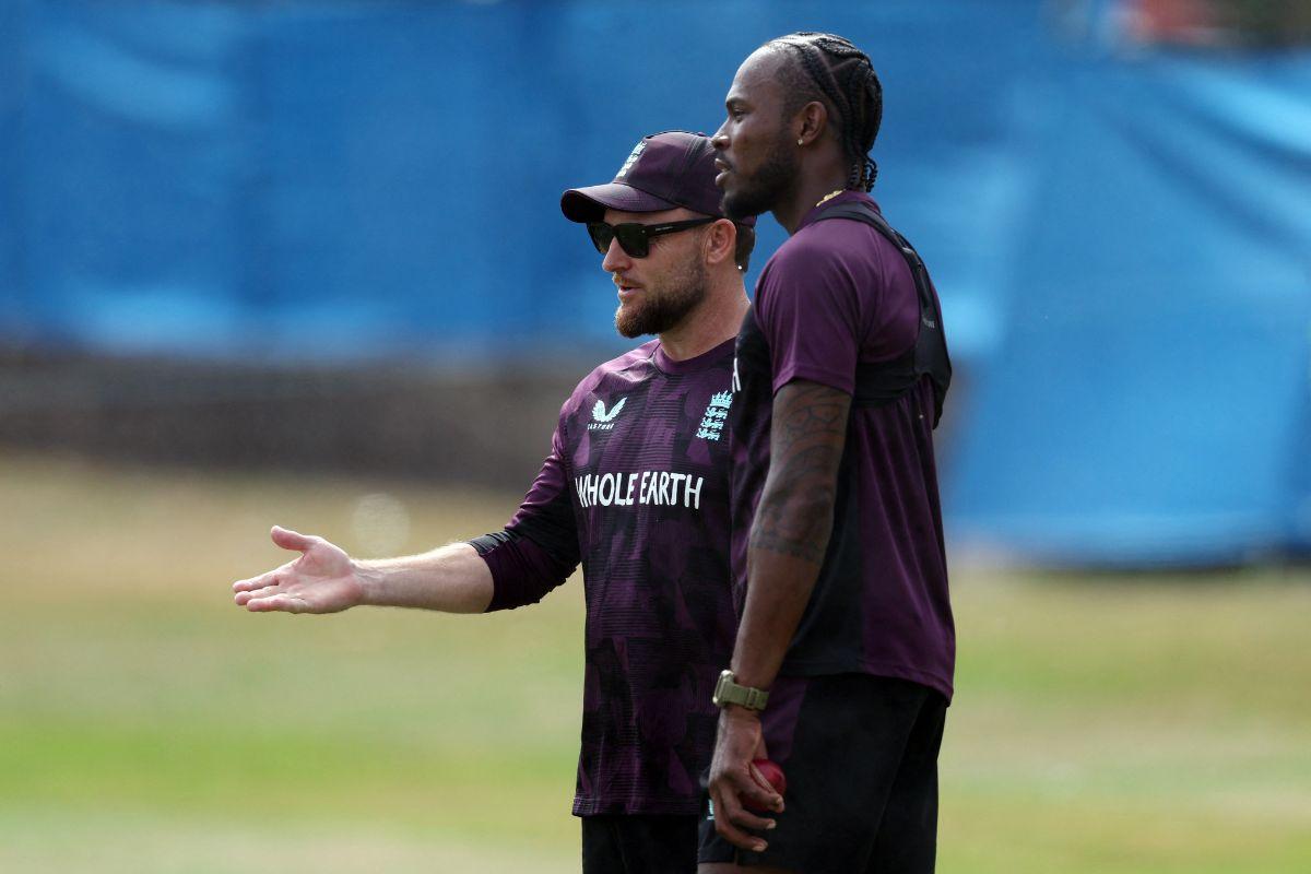  England's Jofra Archer with head coach Brendon McCullum during practice 