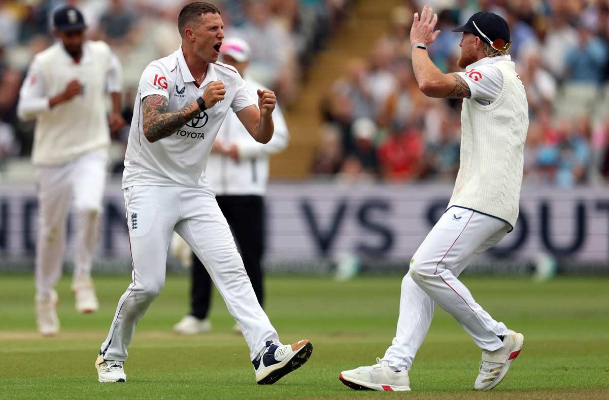 England's Brydon Carse celebrates with Ben Stokes after taking the wicket of India's Karun Nair, caught out by Jamie Smith 