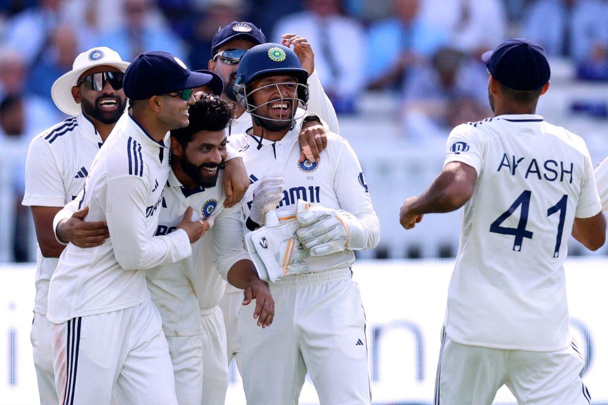 Ravindra Jadeja celebrates with teammates after dismissing Ollie Pope just after the tea break