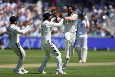 India's Nitish Kumar Reddy celebrates the wicket of Zak Crawley