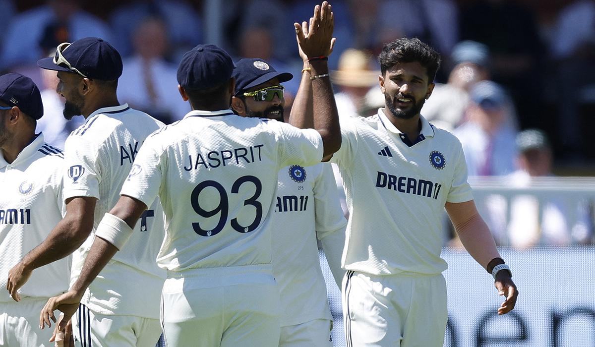 India's Nitish Kumar Reddy celebrates with Jasprit Bumrah after the wicket of England's Zak Crawley