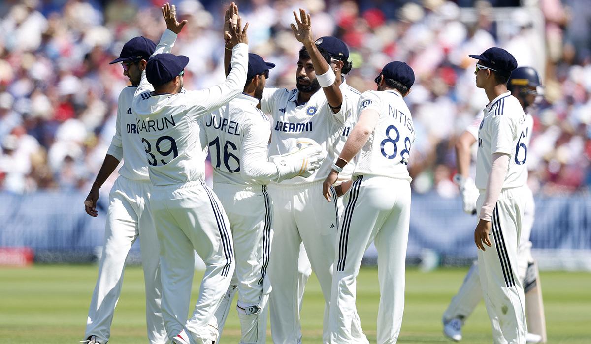 Jasprit Bumrah celebrates with teammates after taking the wicket of Joe Root.