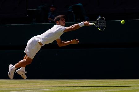 Spain's Carlos Alcaraz in action during his semi final match against Taylor Fritz of the US