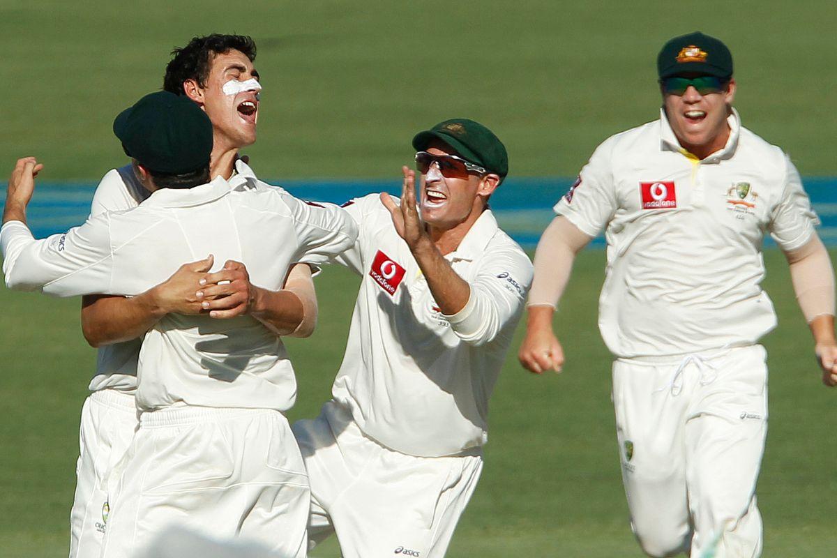 Mitchel Starc (2nd L) celebrates taking the wicket of Sachin Tendulkar during the second day of their third cricket Test at the WACA in Perth, on January 14, 2012