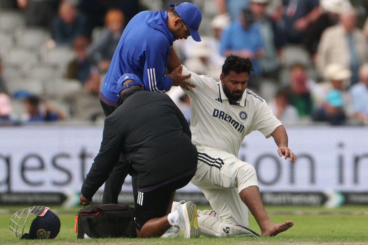 India's Rishabh Pant receives medical attention after being hit on the foot by a ball bowled by England's Chris Woakes. He was unable to continue and retired hurt.