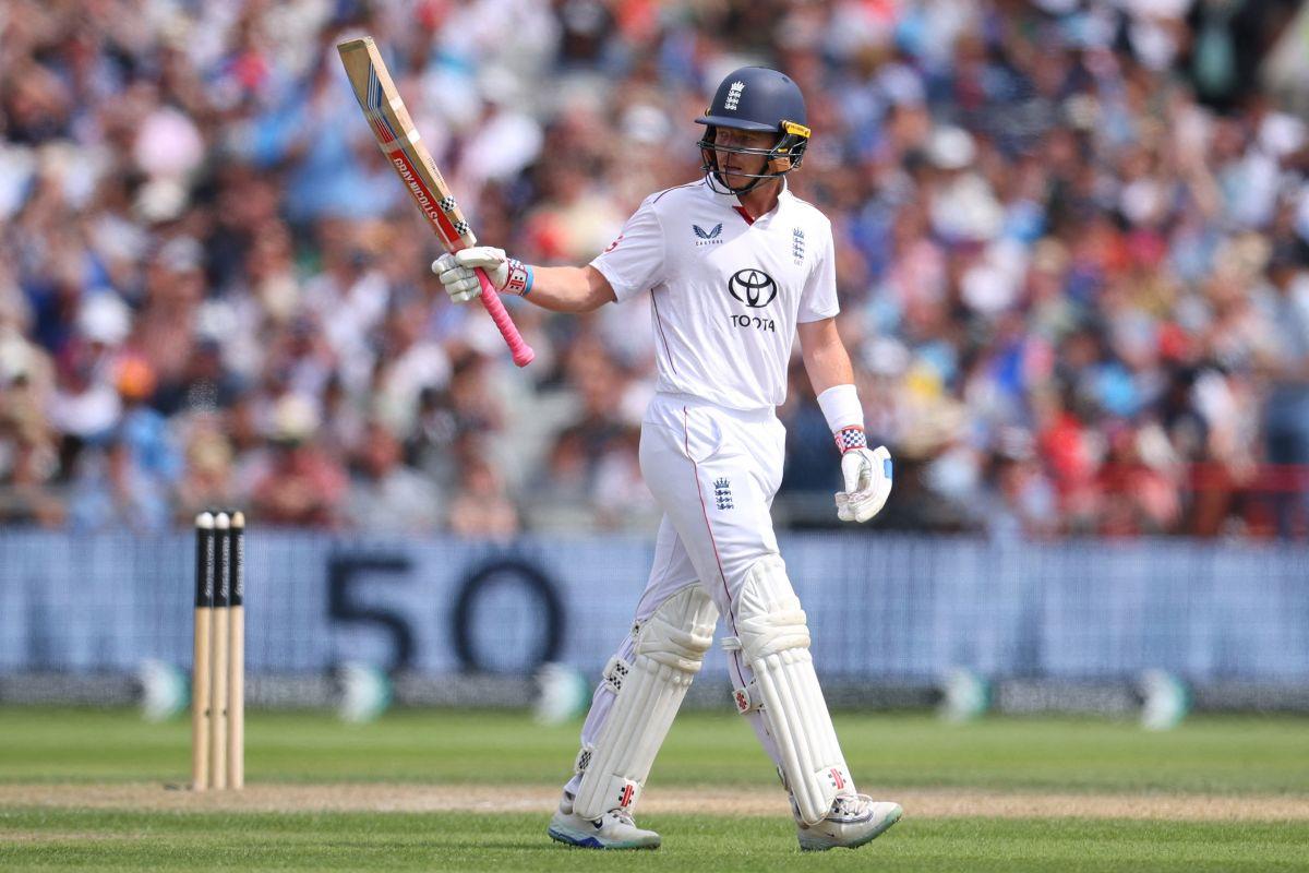 Ollie Pope celebrates after reaching his half century