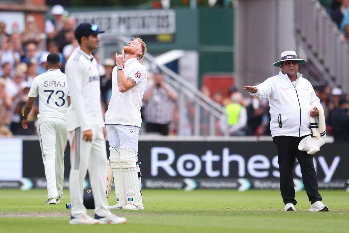England's Ben Stokes celebrates after hitting four runs to reach his century