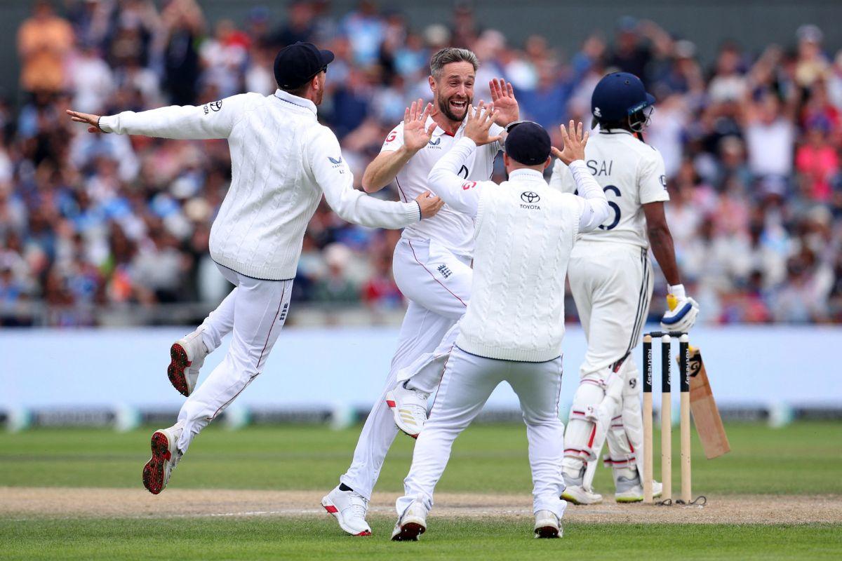 England's Chris Woakes celebrates with teammates after taking the wicket of India's Sai Sudharsan