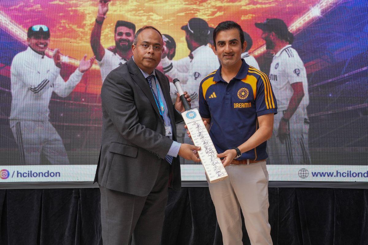 India Head Coach Gautam Gambhir presents a bat to Deputy High Commissioner Sujit Ghosh 