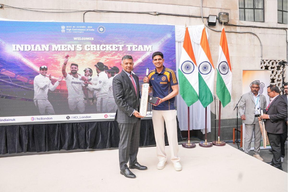 Shubman Gill presents a bat to High Commissioner of India Vikram Doraiswami in London on Monday