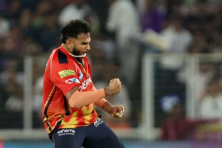 Punjab Kings' Vijaykumar Vyshak celebrates after the wicket of Mumbai Indians' Jonny Bairstow