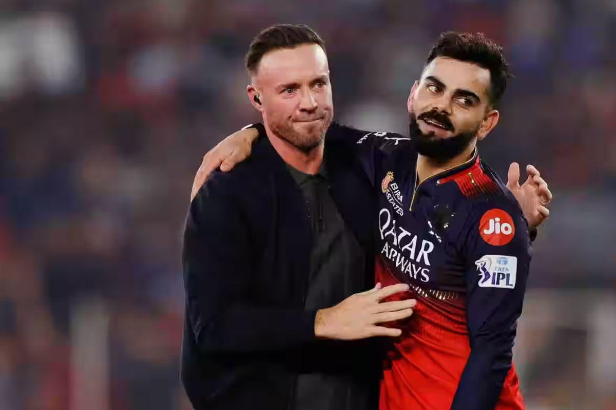 AB de Villiers celebrates with Virat Kohli following Royal Challengers Bengaluru's win over Punjab Kings to lift the IPL trophy in Ahmedabad on Tuesday 