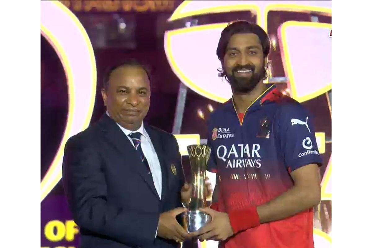 Krunal Pandya with the Player of the Match award after his match-winning spell of 2 for 17