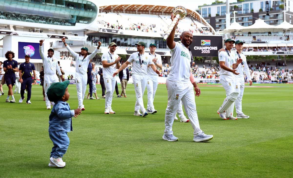  Temba Bavuma celebrates and his son Lihle with the ICC Test Championship Mace at Lord's on Saturda