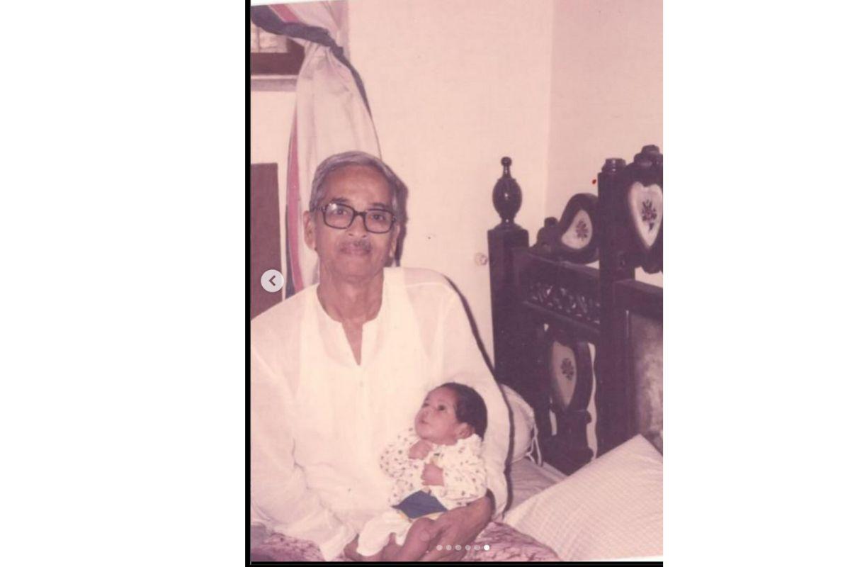 Masaba cradled by her maternal grandfather