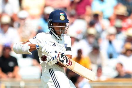 India's Yashasvi Jaiswal reacts after getting hit by a ball