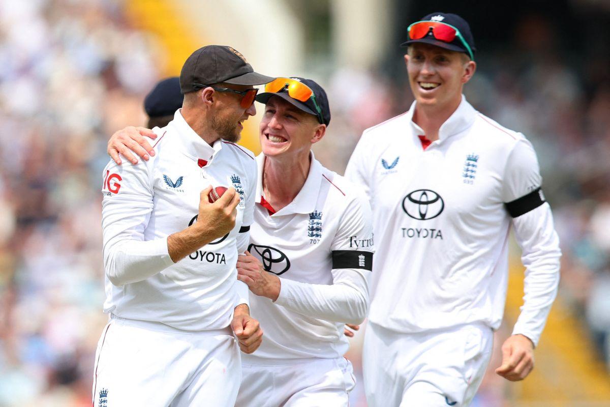 England's Joe Root celebrates with teammates after taking the catch to dismiss India's KL Rahul, off the bowling of Brydon Carse