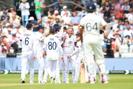 England's Ben Stokes celebrates with teammates after taking the wicket of India's Sai Sudharsan
