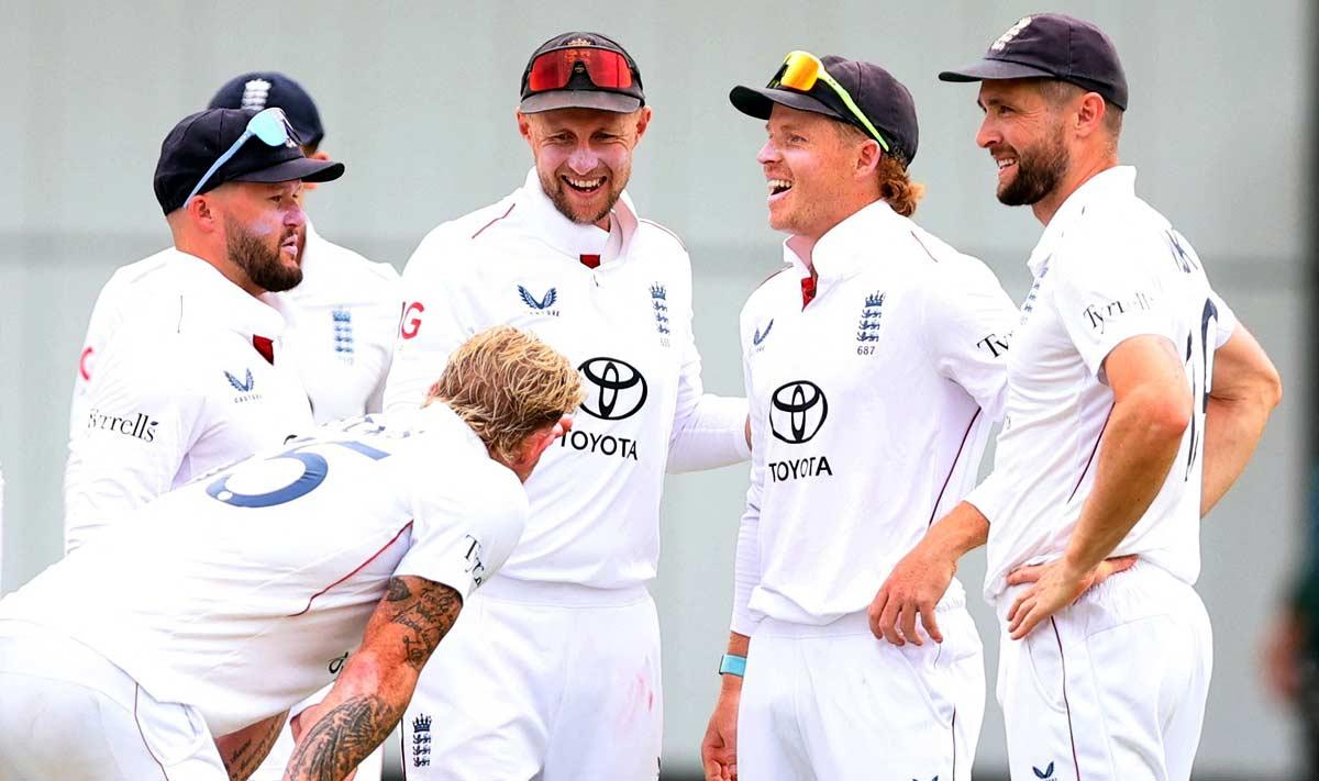 Ben Stokes celebrates with teammates after taking the wicket of Karun Nair. 